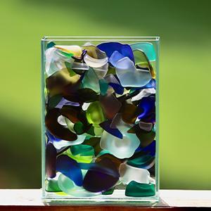 Shards of Hope  / Shards of Hope (2025). Sculpture of tumbled glass in a rectangular vase  