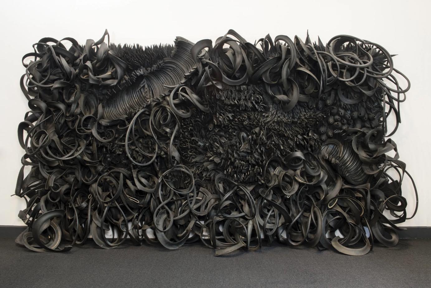 Ramanda Miller - Image 3  / Title: Acid Rain • Artist: Chakaia Booker (American, b. 1953) • Date: ca. 2001 • Medium: Rubber tires and wood • Dimensions: 200 x 240 x 36 inches • Credit: National Museum of Women in the Arts, Museum purchase: Members' Acquisition Fund  