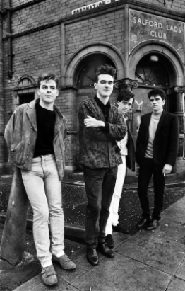 Stephanie Geiger - Image 2 - The Smiths  / Manchester band The Smiths outside the Salford Lads Club. Fans travel from around the world to take their own photo outside of the building just as The Smiths did. Photographed by Stephen Wright, 1985.  