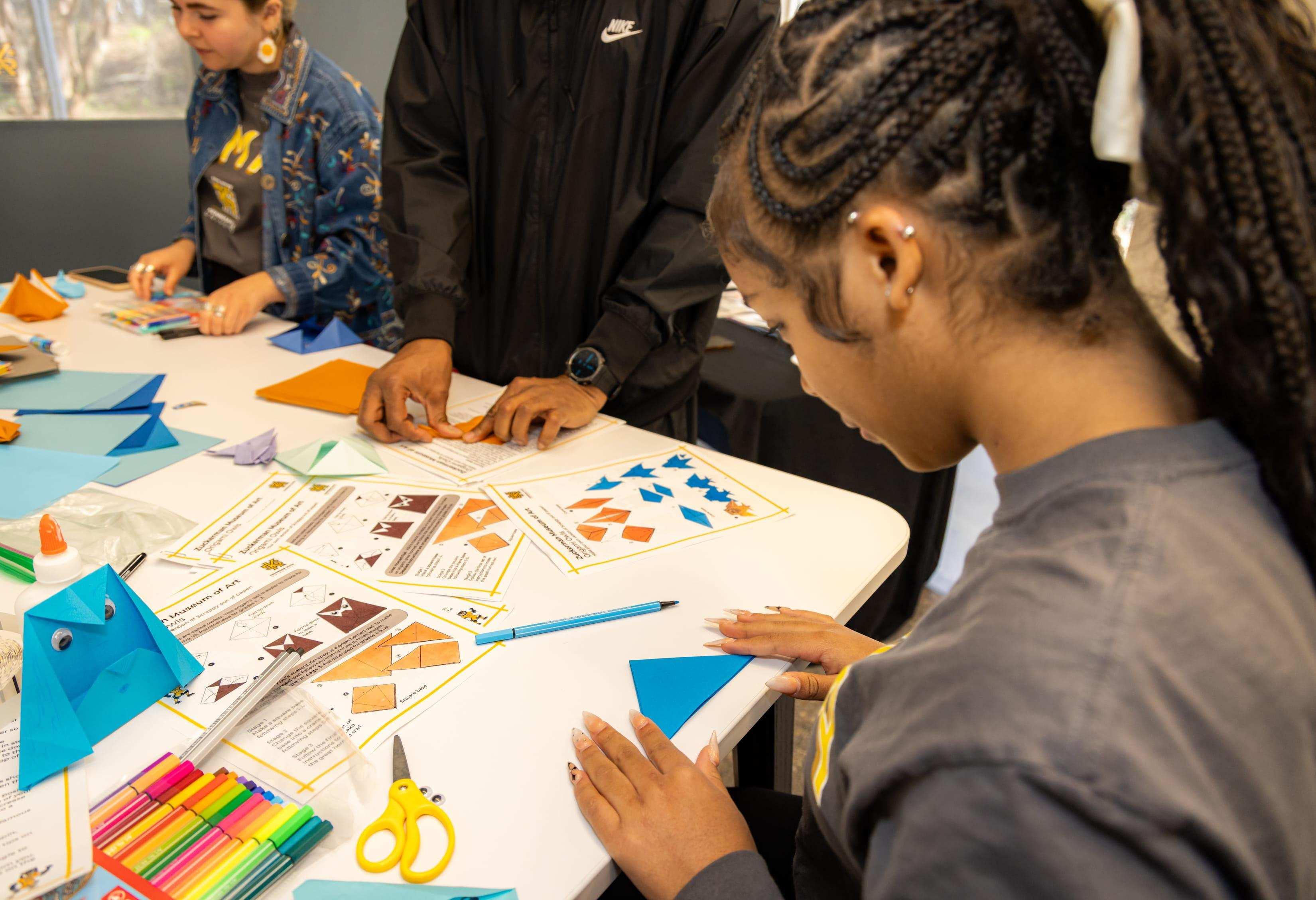 K-12 student making origami  / 
