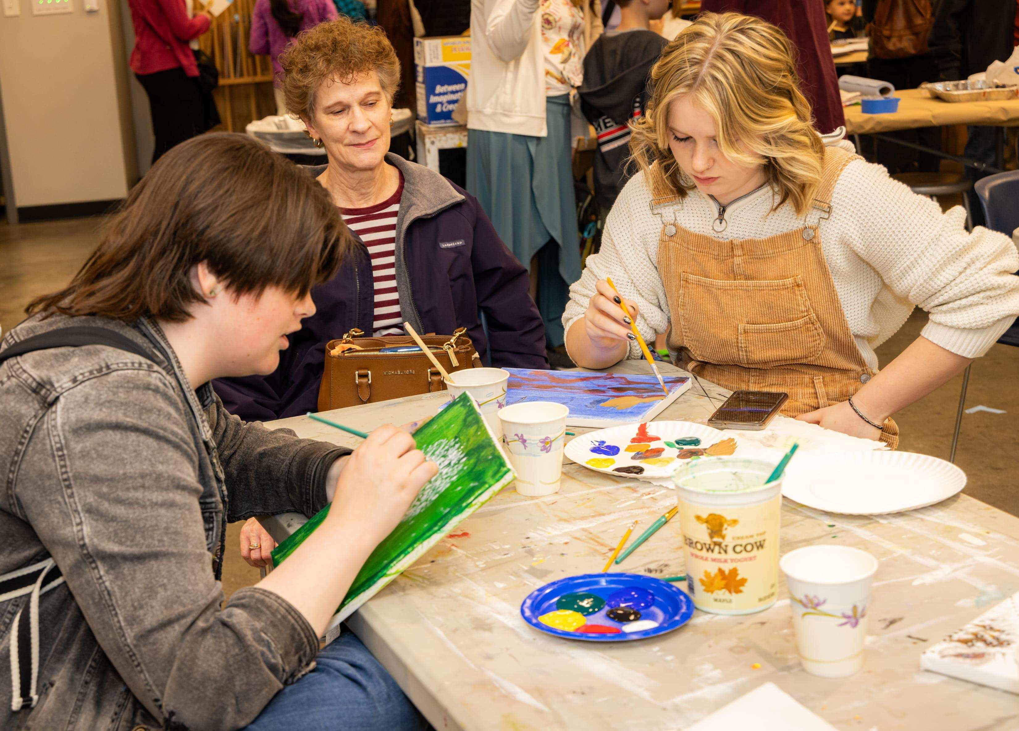 K-12 students painting together  / 