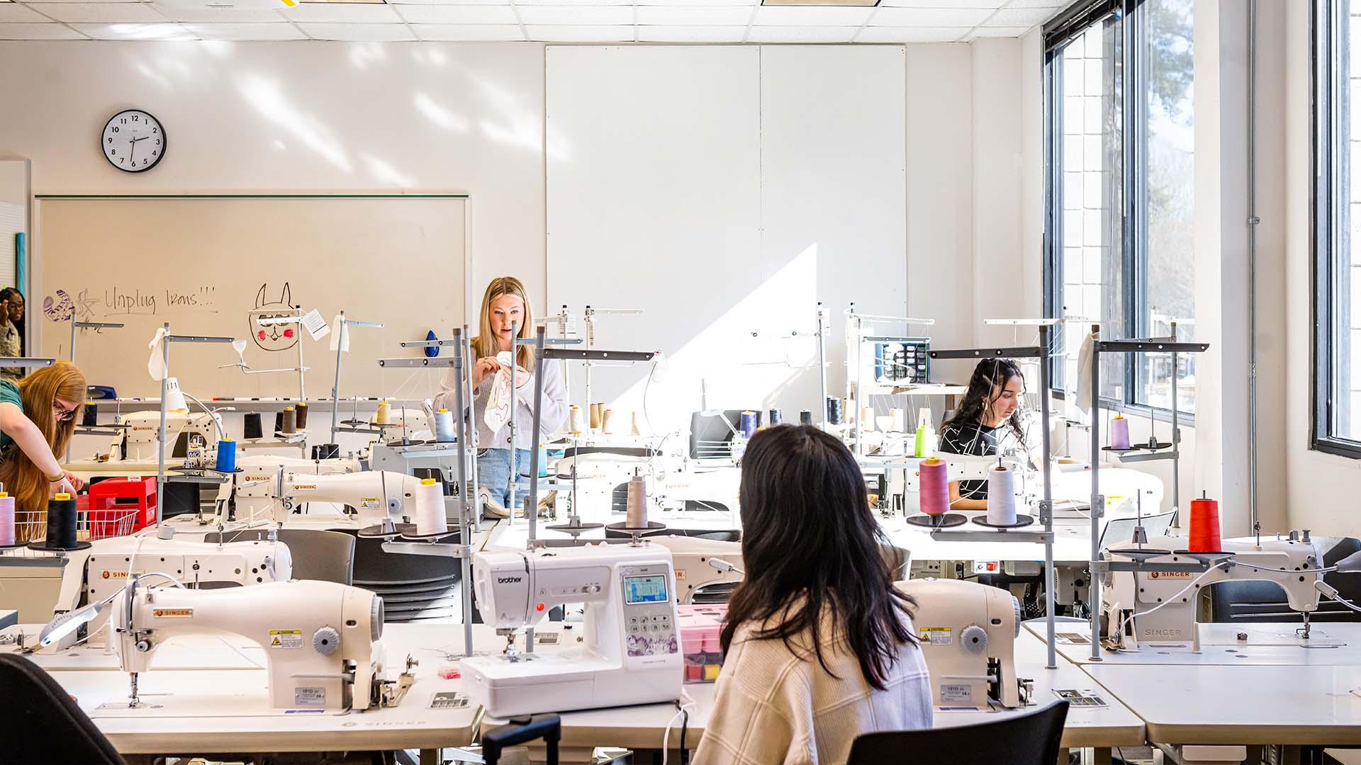  / Textiles students working in sewing lab.  
