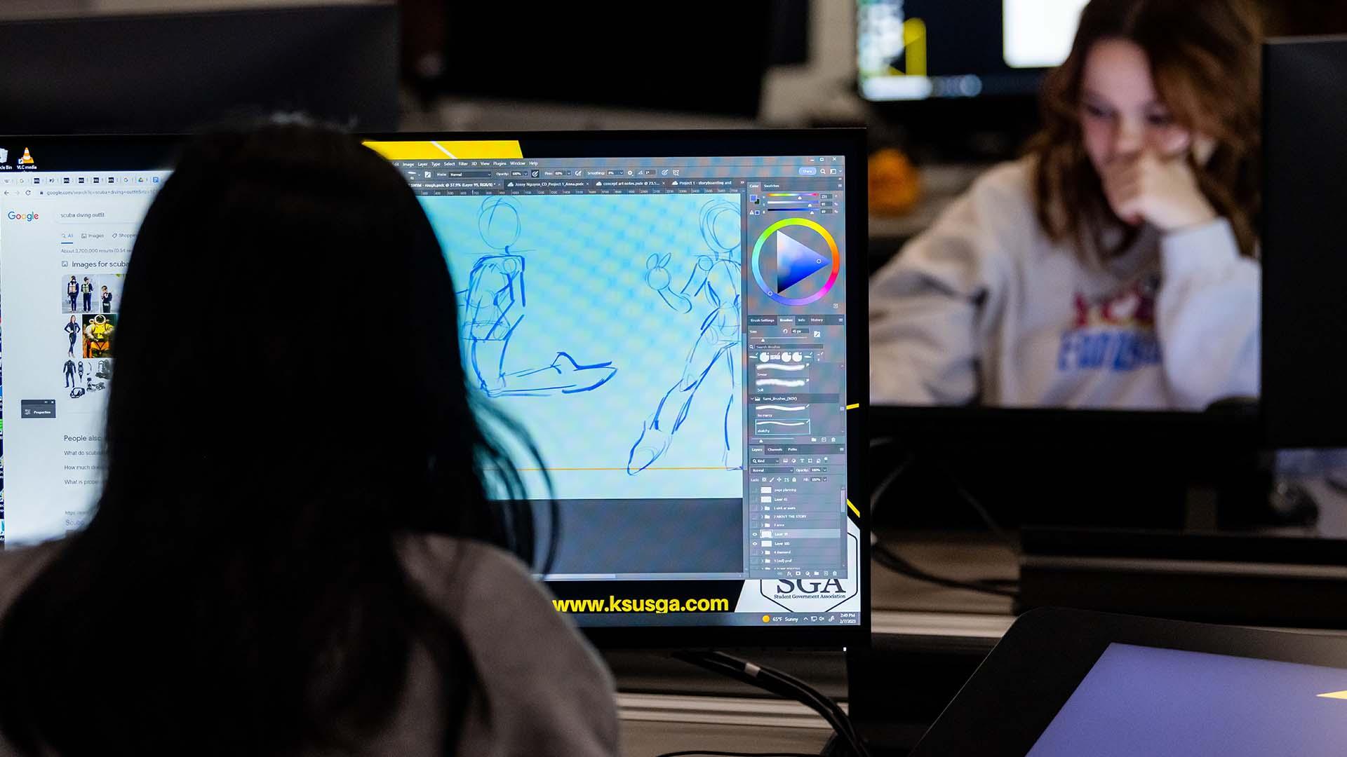  / Animation students working on character design in computer lab.  
