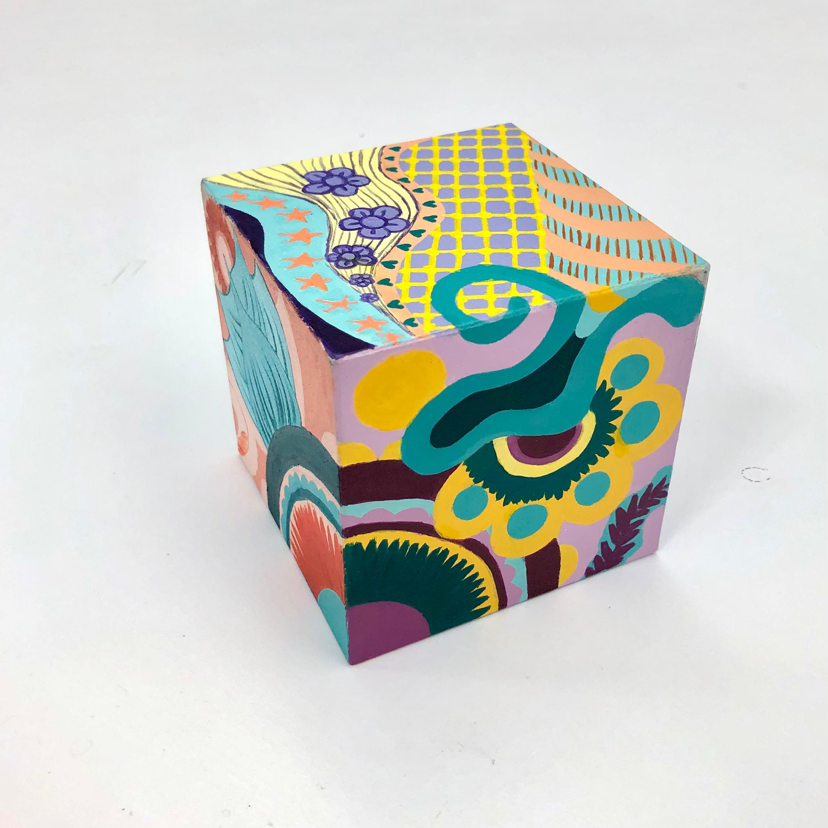 Aman Kaur  / Aman Kaur, "Color Scheme Cube Design" acrylic paint and paint marker on 3" craft cube. The goal was to create a continuous, ongoing design while presenting a different one of the 6 color schemes studied in class.  
