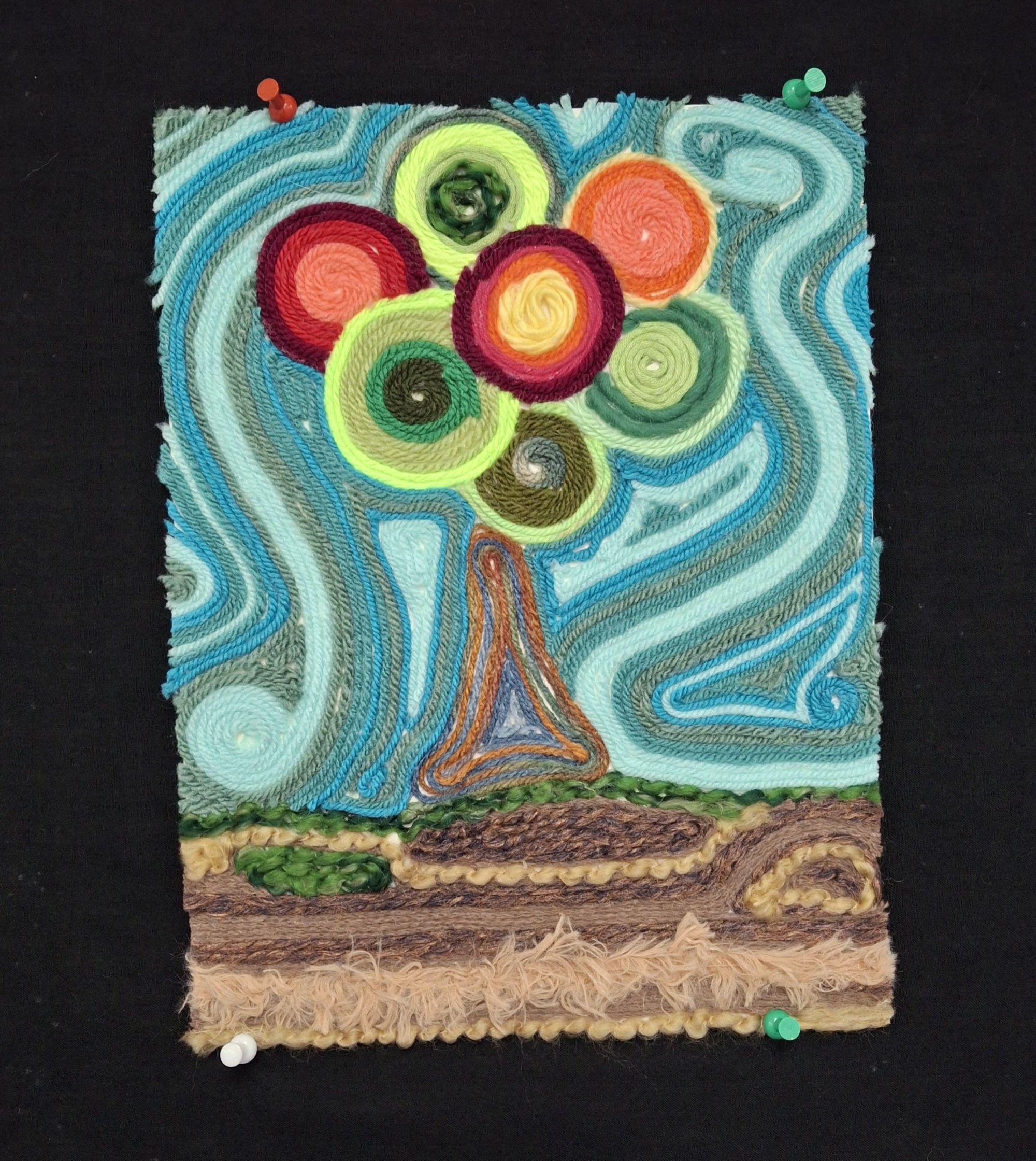 Colorful abstract embroidery of a tree with a swirly background on a black surface.  / Yarn painting example for 7th grade project on the Huichol people of Mexico.  