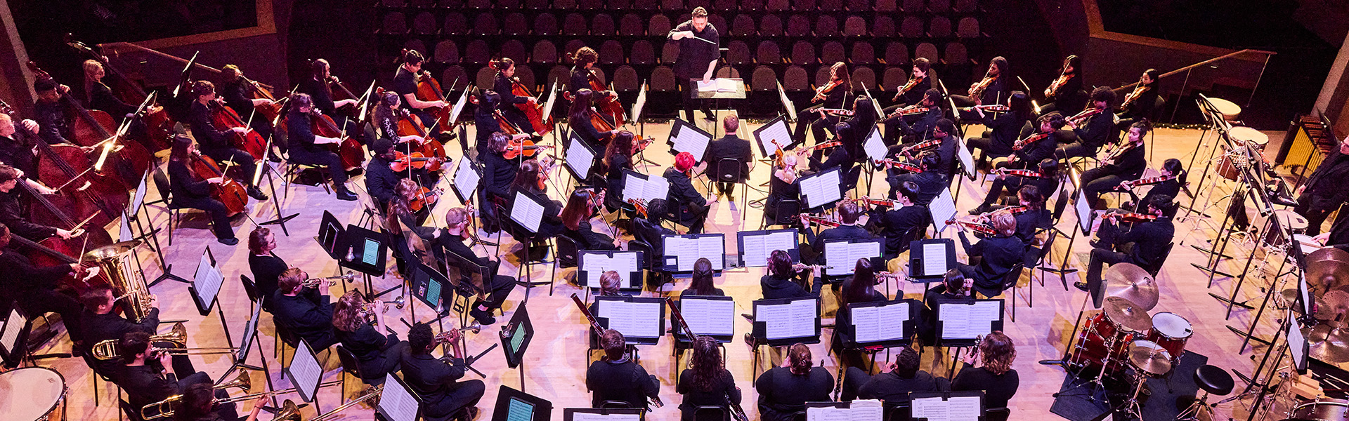 band students in front of dramatic black landscape