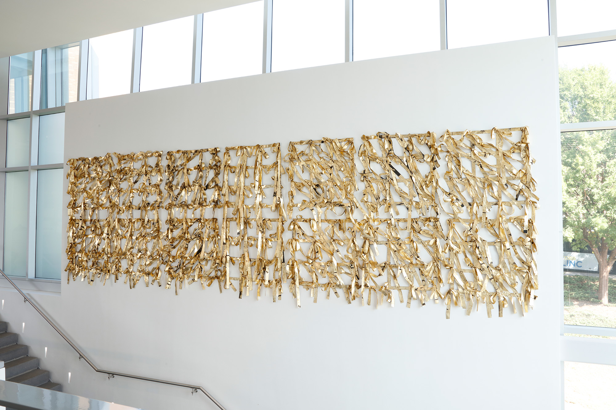 large gold and black textile piece