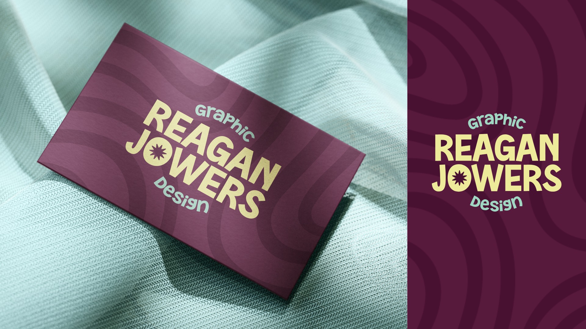 Light yellow "Reagan Jowers" text on a purple business card. Card is sitting on teal fabric.