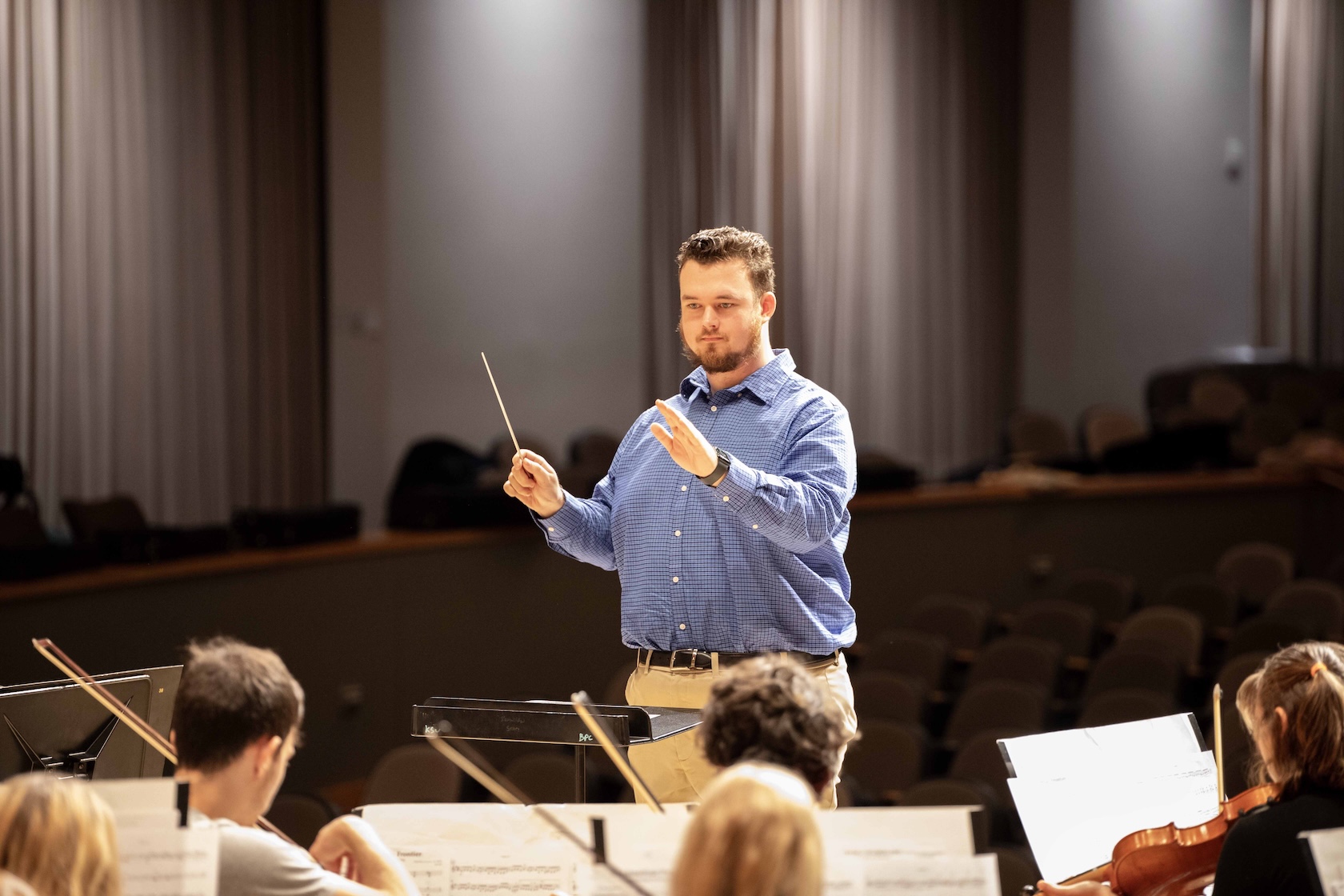 Brandon Gasaway conducting the University Philharmonic Orchestra