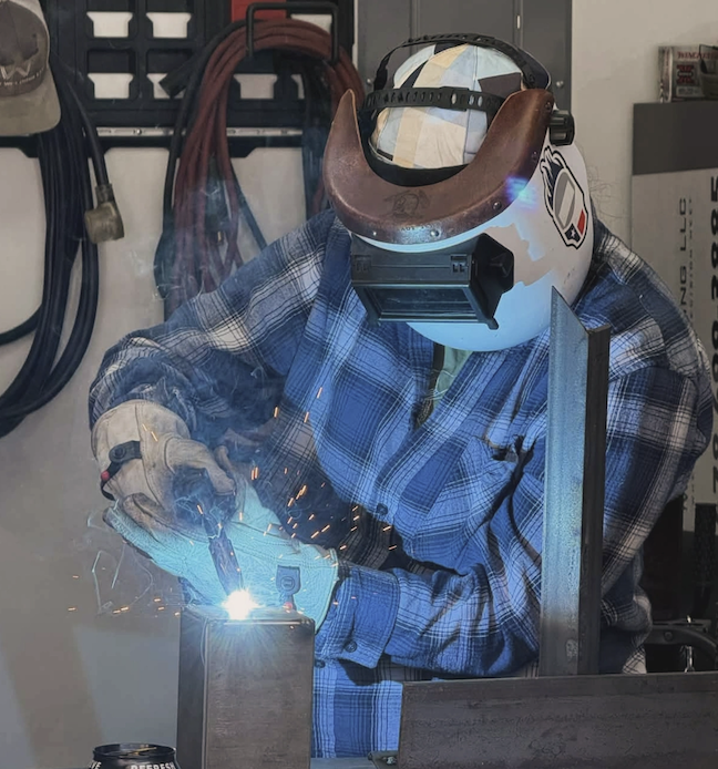 a student welds in a master craftsman studio
