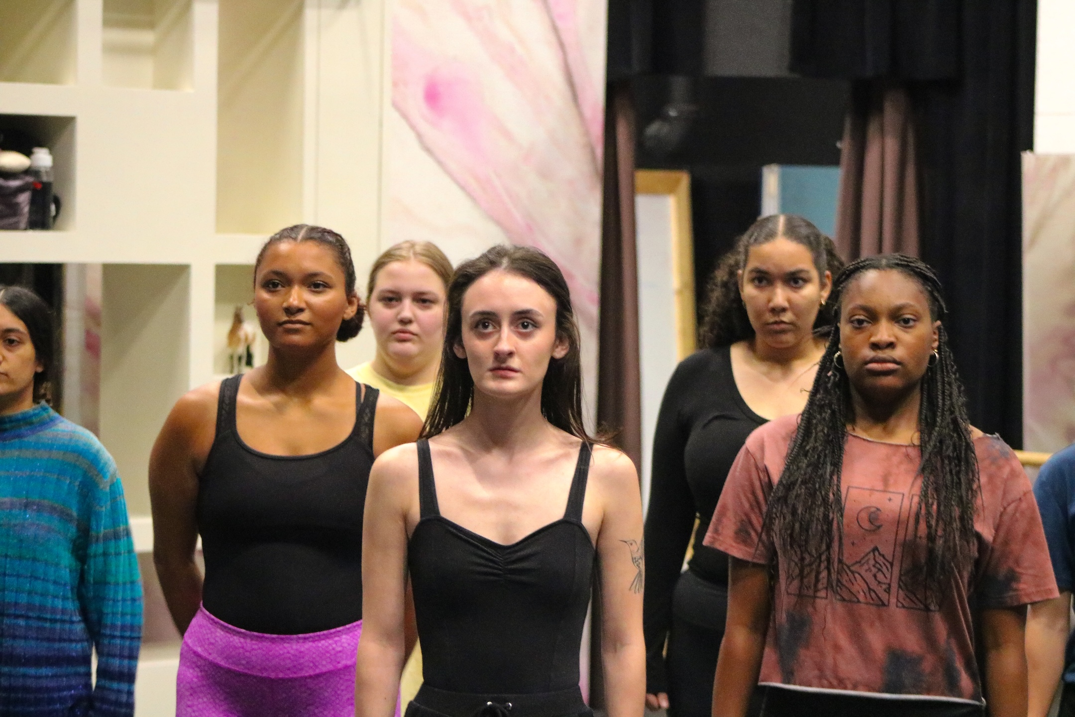 actors rehearse on stage for a production of Dance Nation