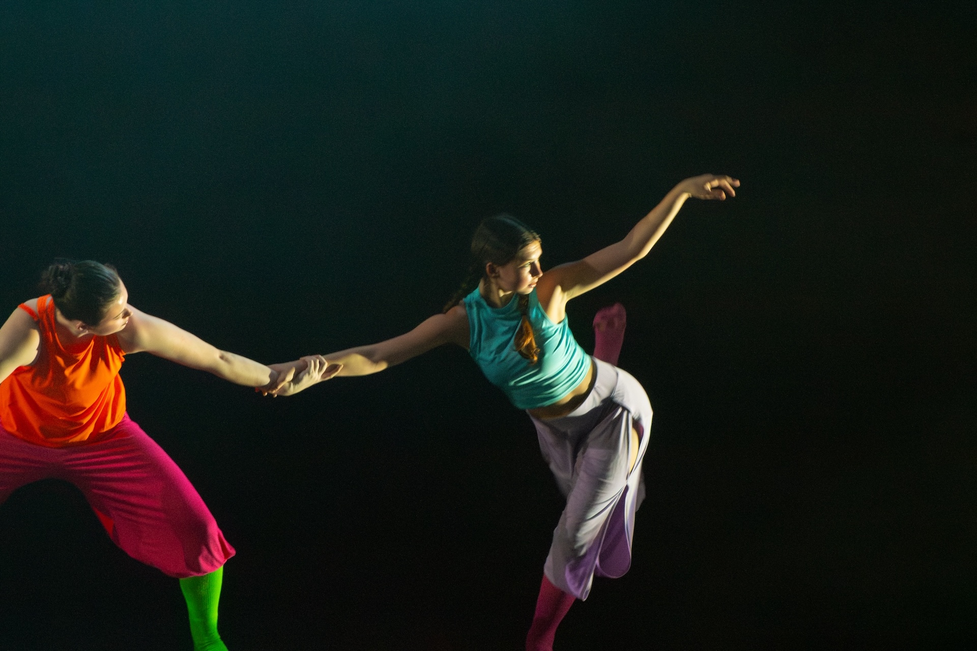 dancers rehearse in colorful costumes