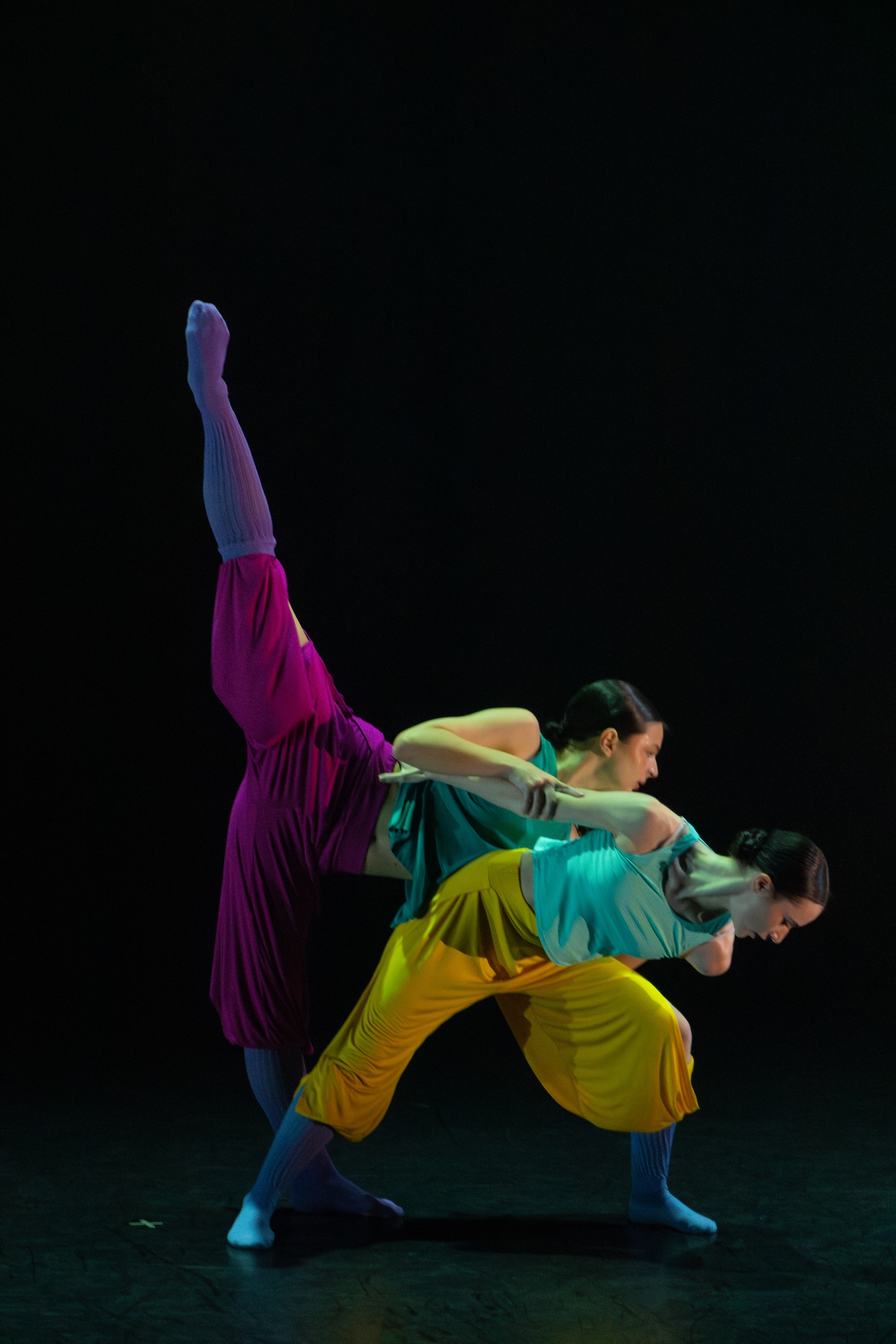 dancers rehearse in colorful costumes