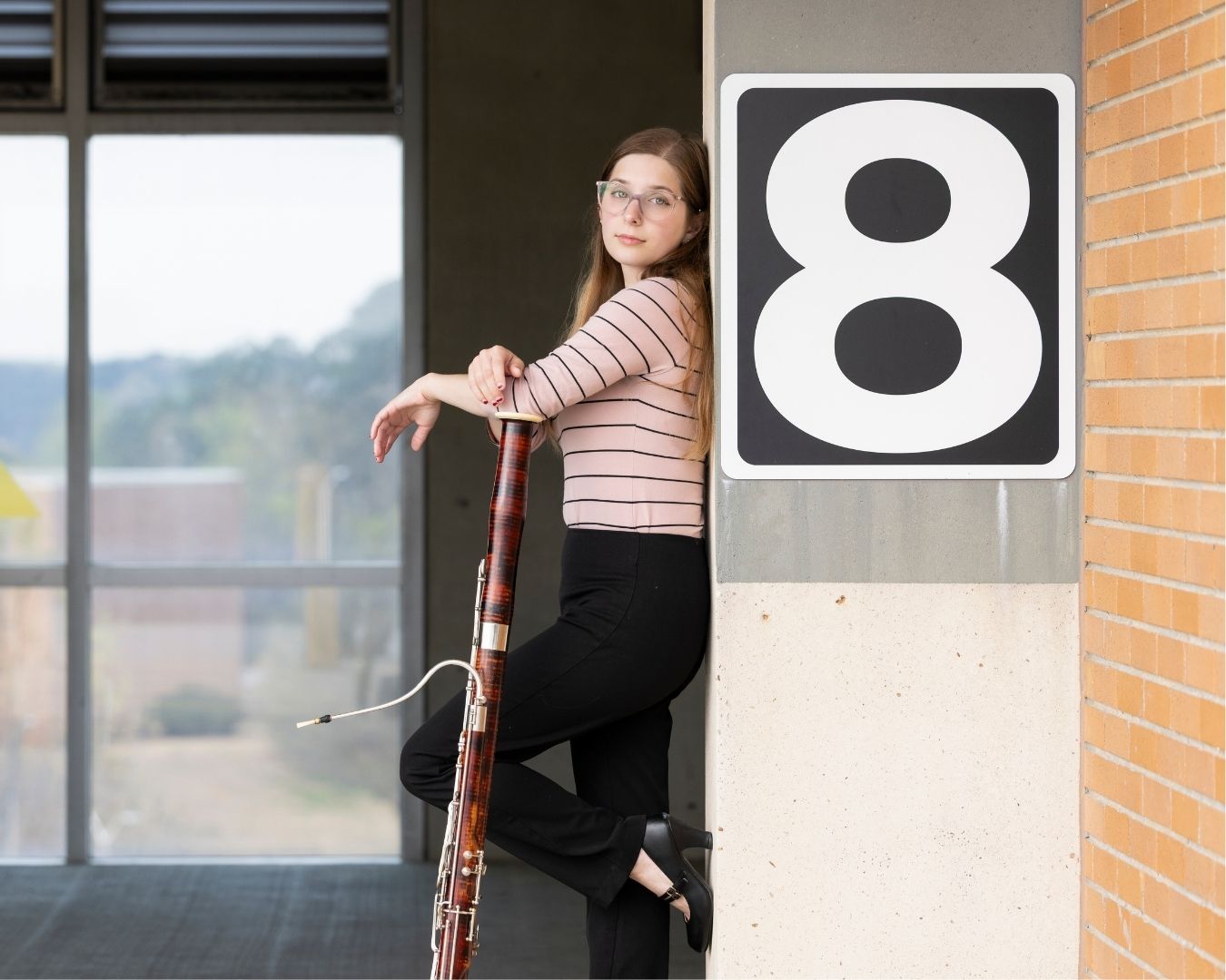 basson_player_leaning_on_wall