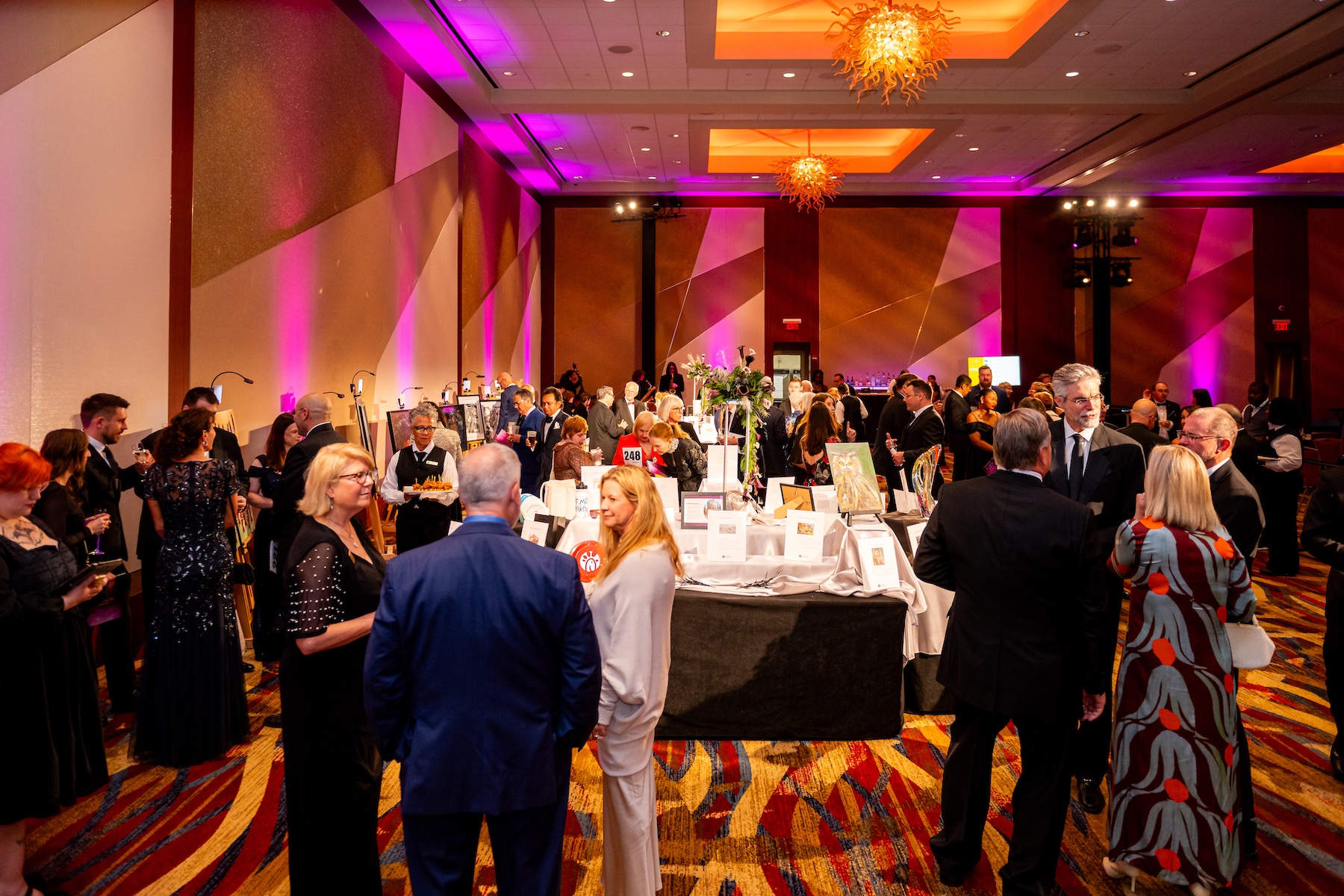 guests browse auction items at the 2025 ArtsKSU gala