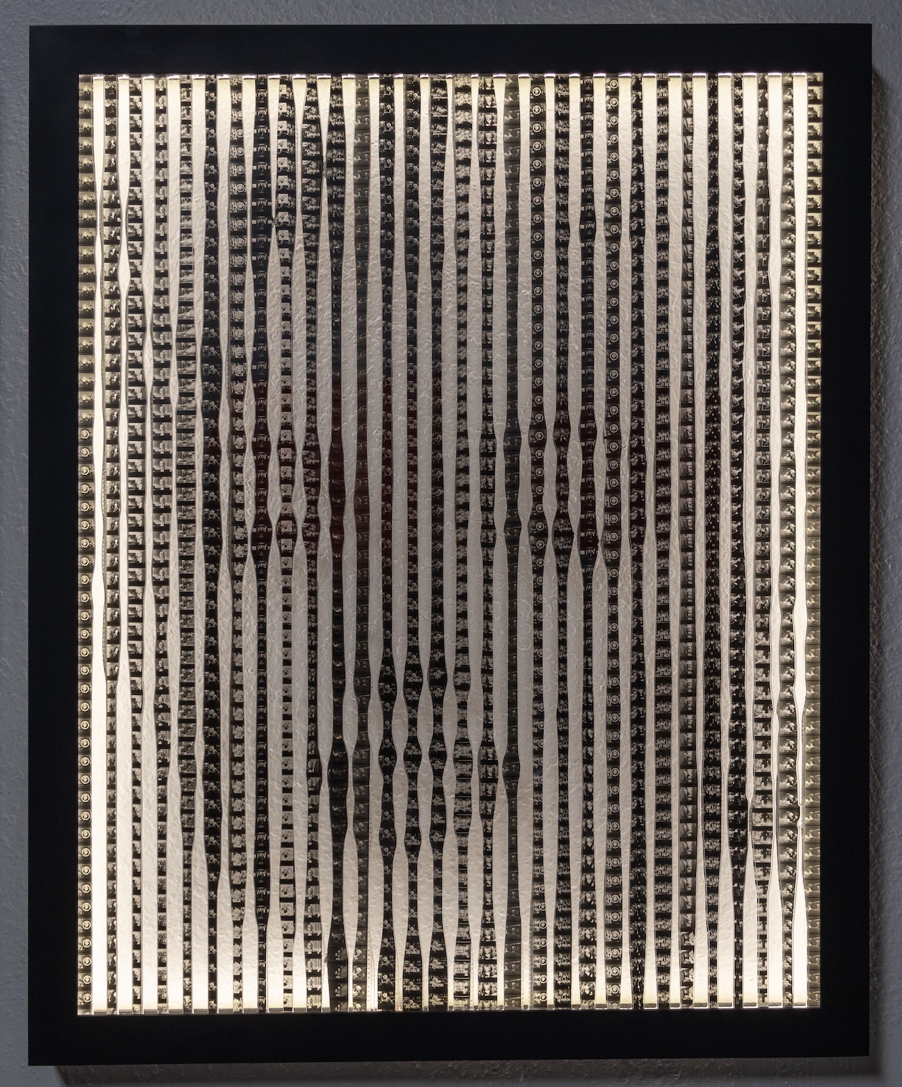 an image of marilyn monroe constructed from strips of film