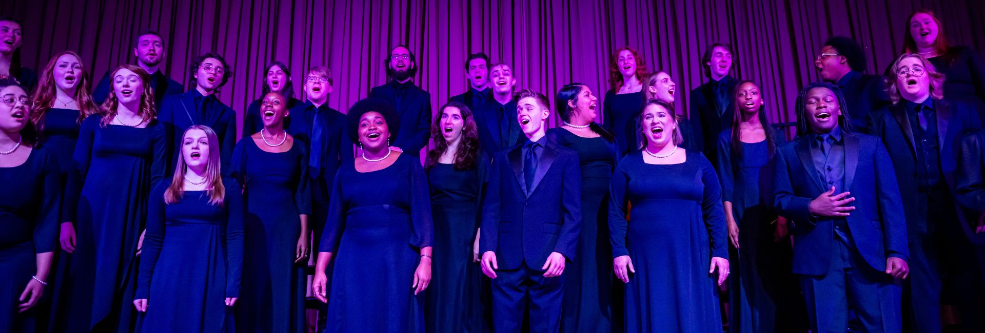 group of choir students performing on stage