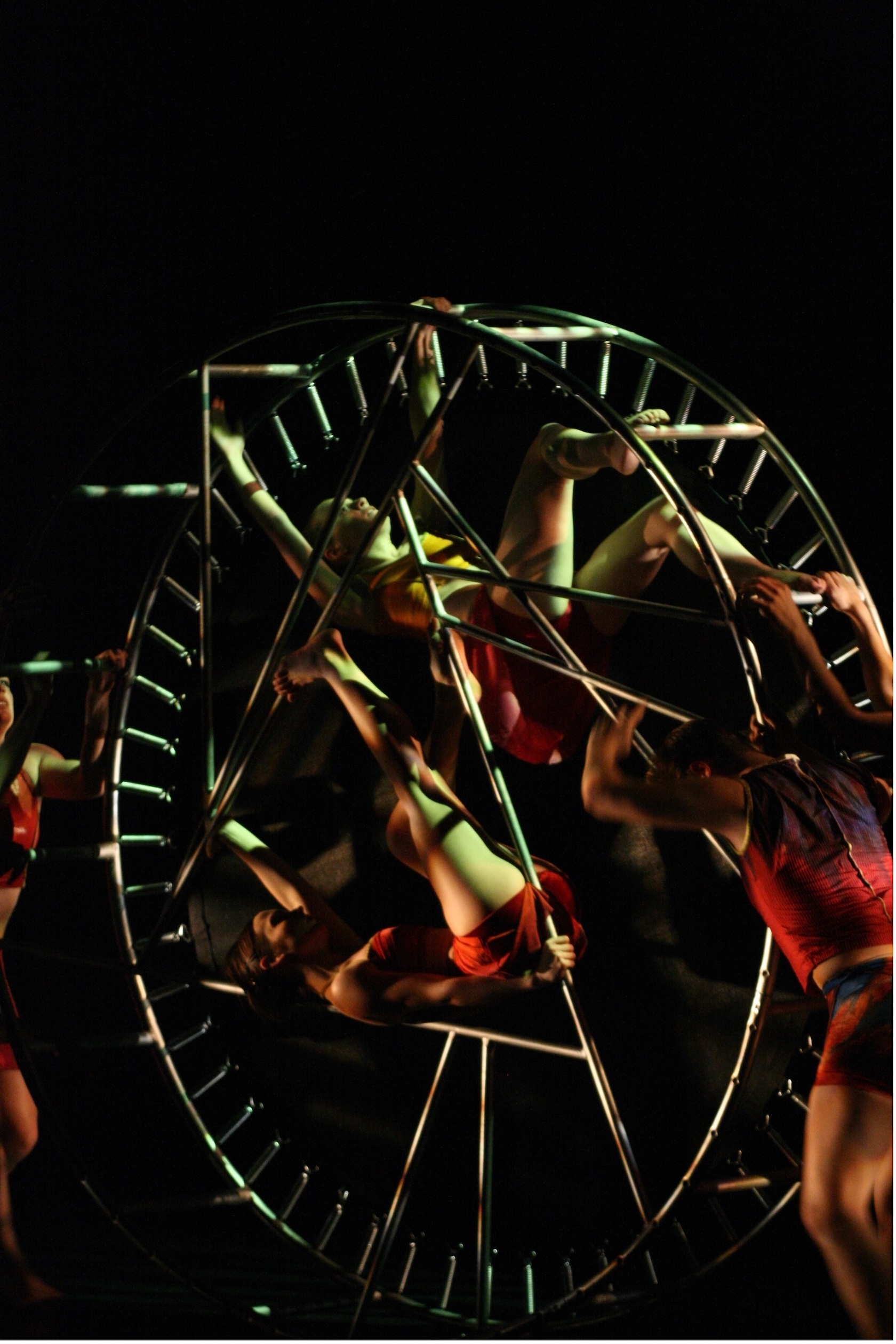 dancers are on a large wheel