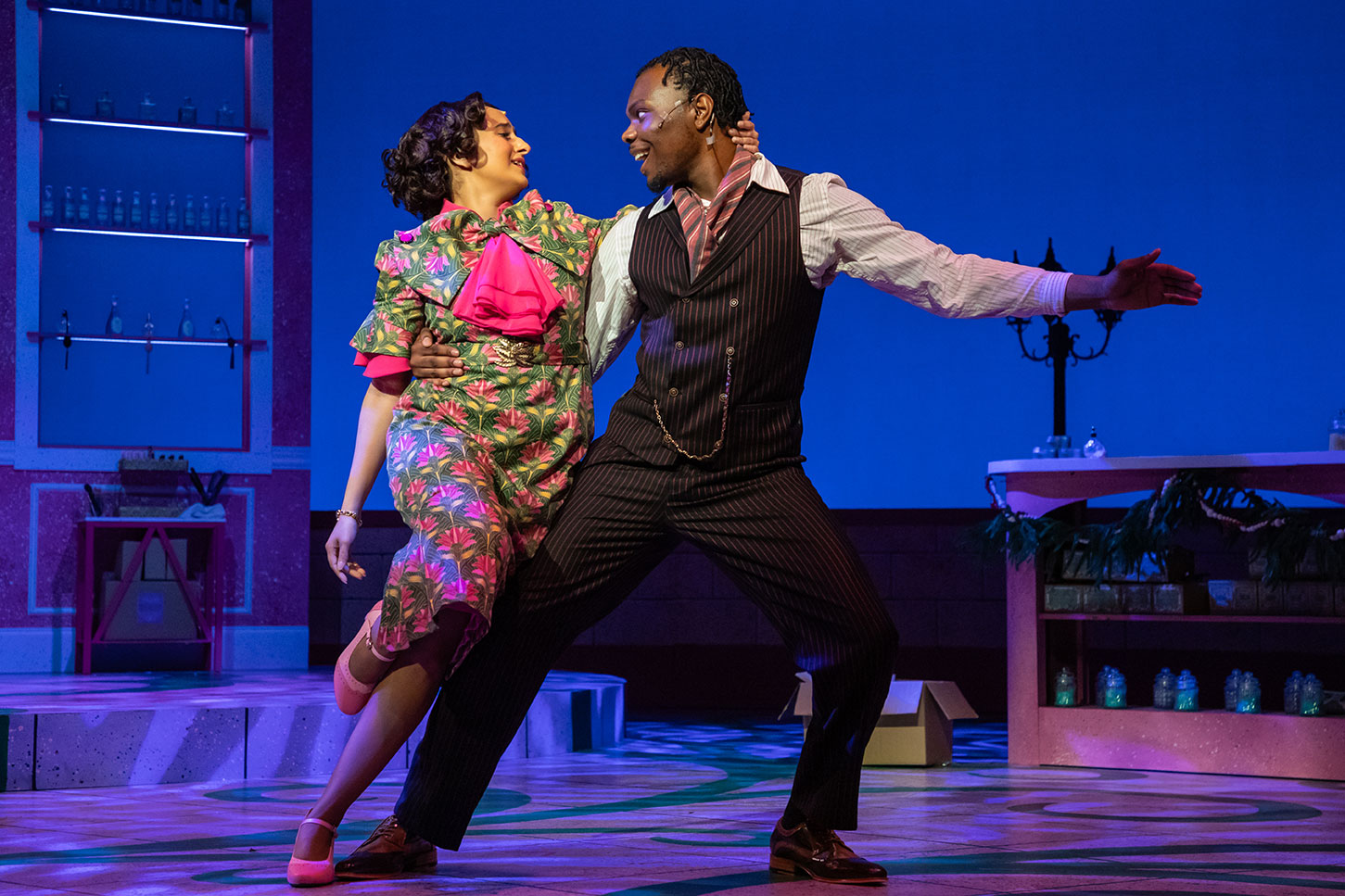 A couple dances on stage.