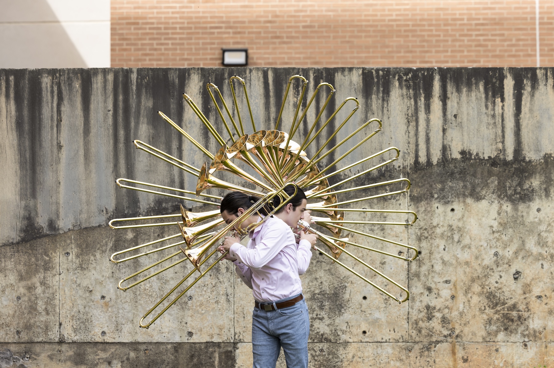 a trombone player moves as he plays