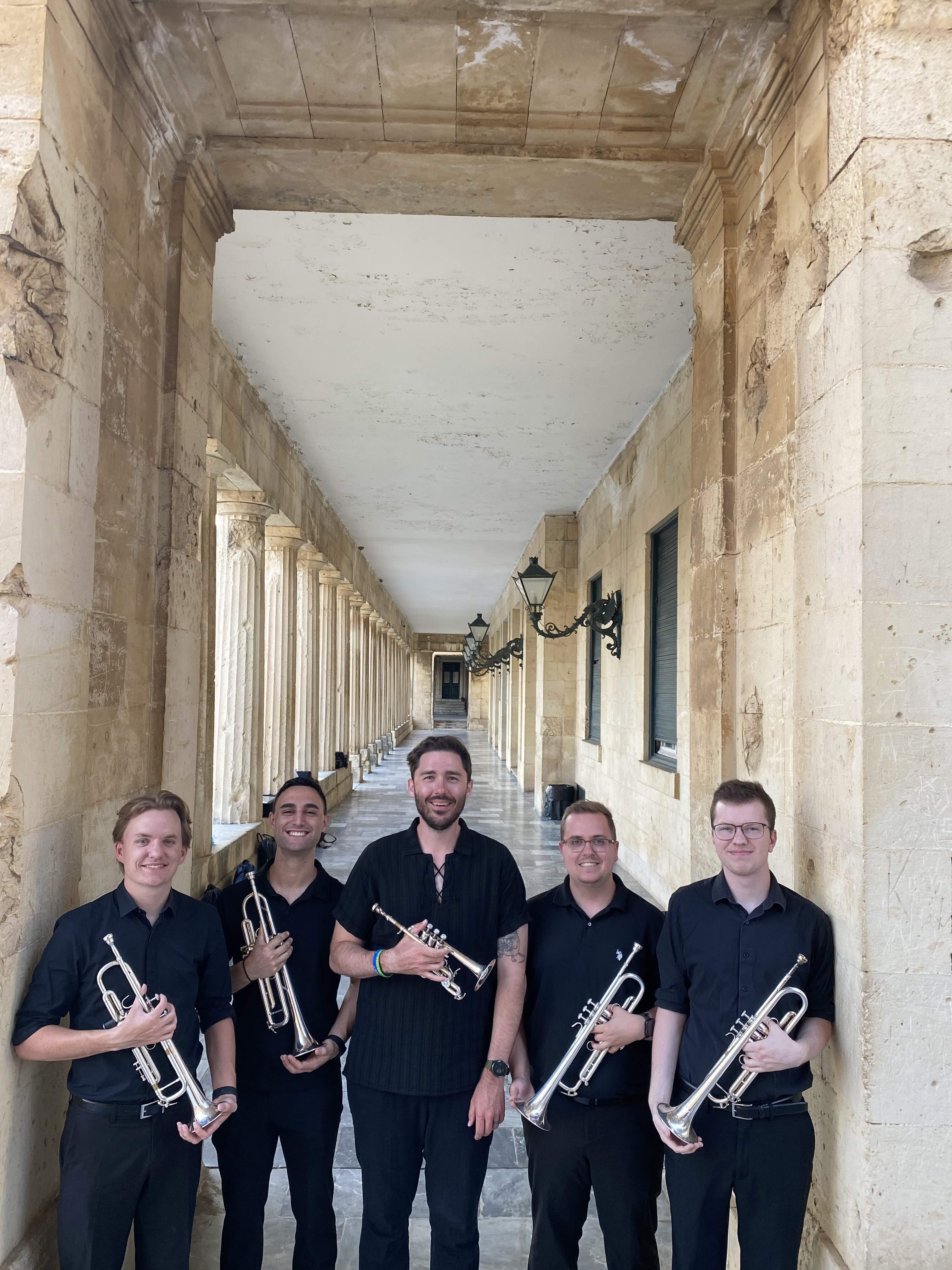 Dr. Stephen Wadsack with four trumpet players in Greece