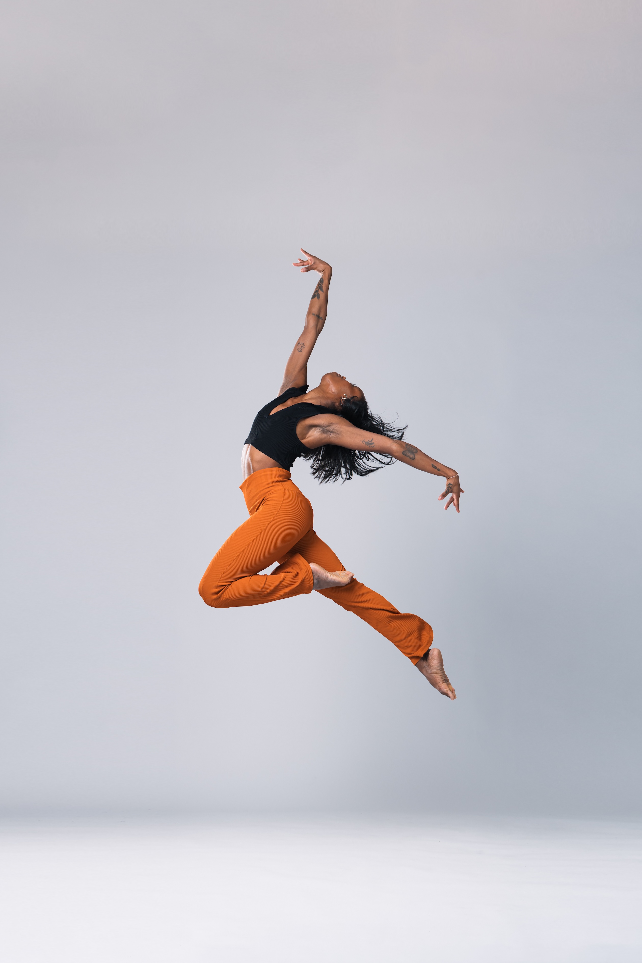 a dancer leaps in the air