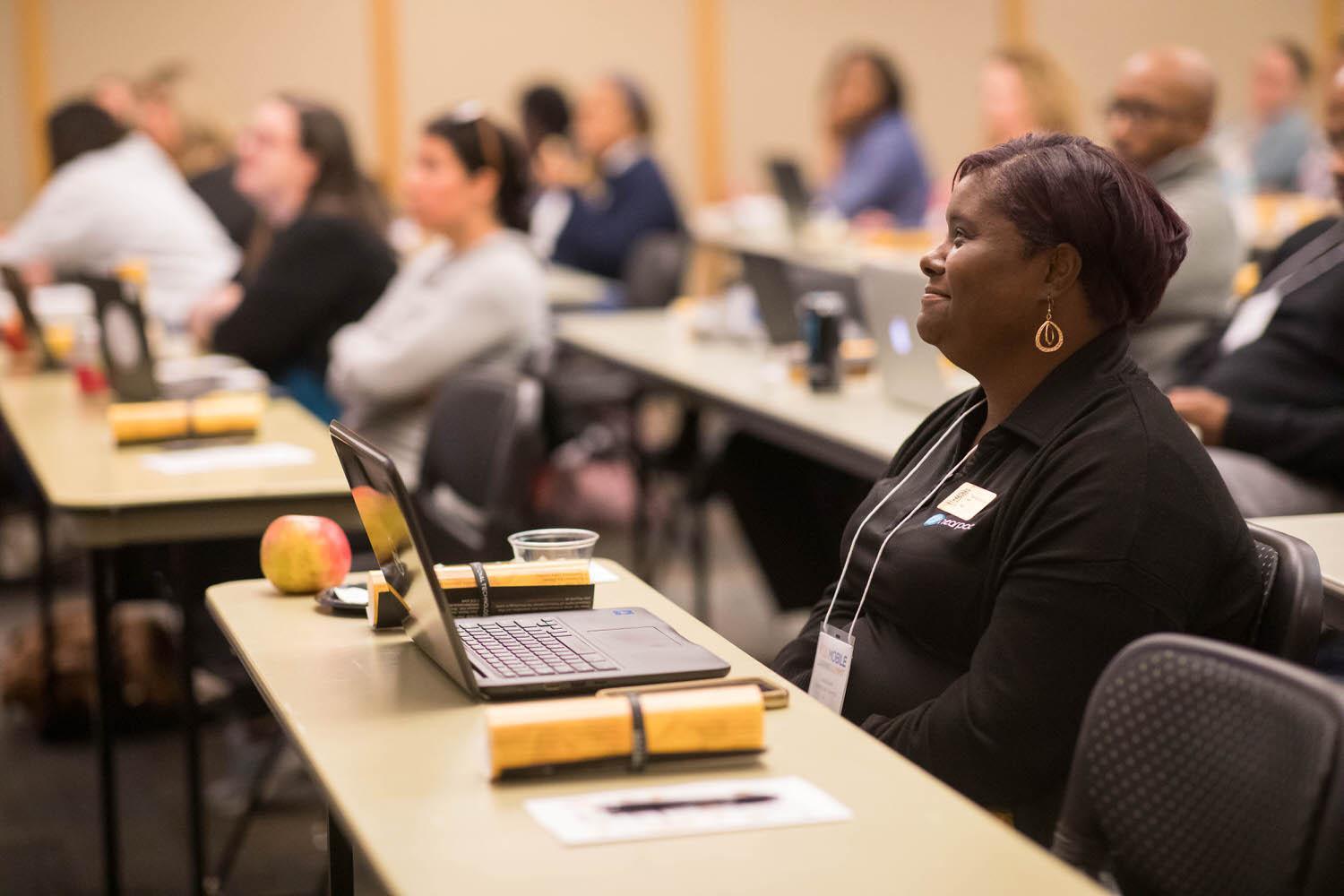 Mobile Learning Summit / Mobile Learning Summit
Group at tables listening to Seminar