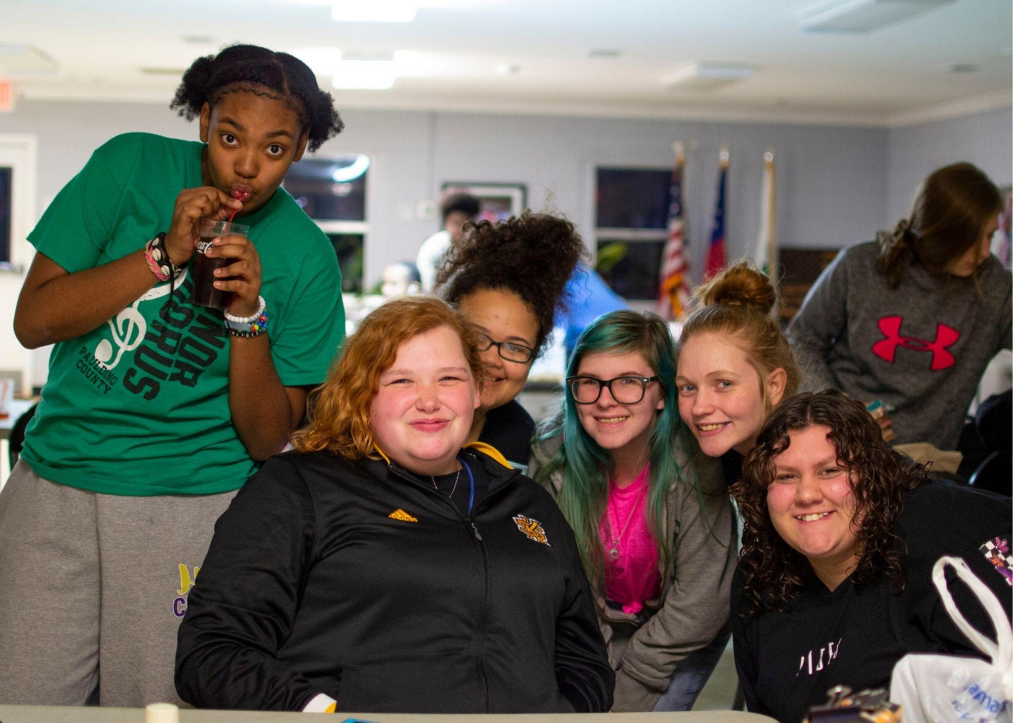 Women smiling while attending a Women's Empowerment Conference  / KSU TRiO holds a Women's Empowerment Conference to provide a space space for women to learn and grow. 