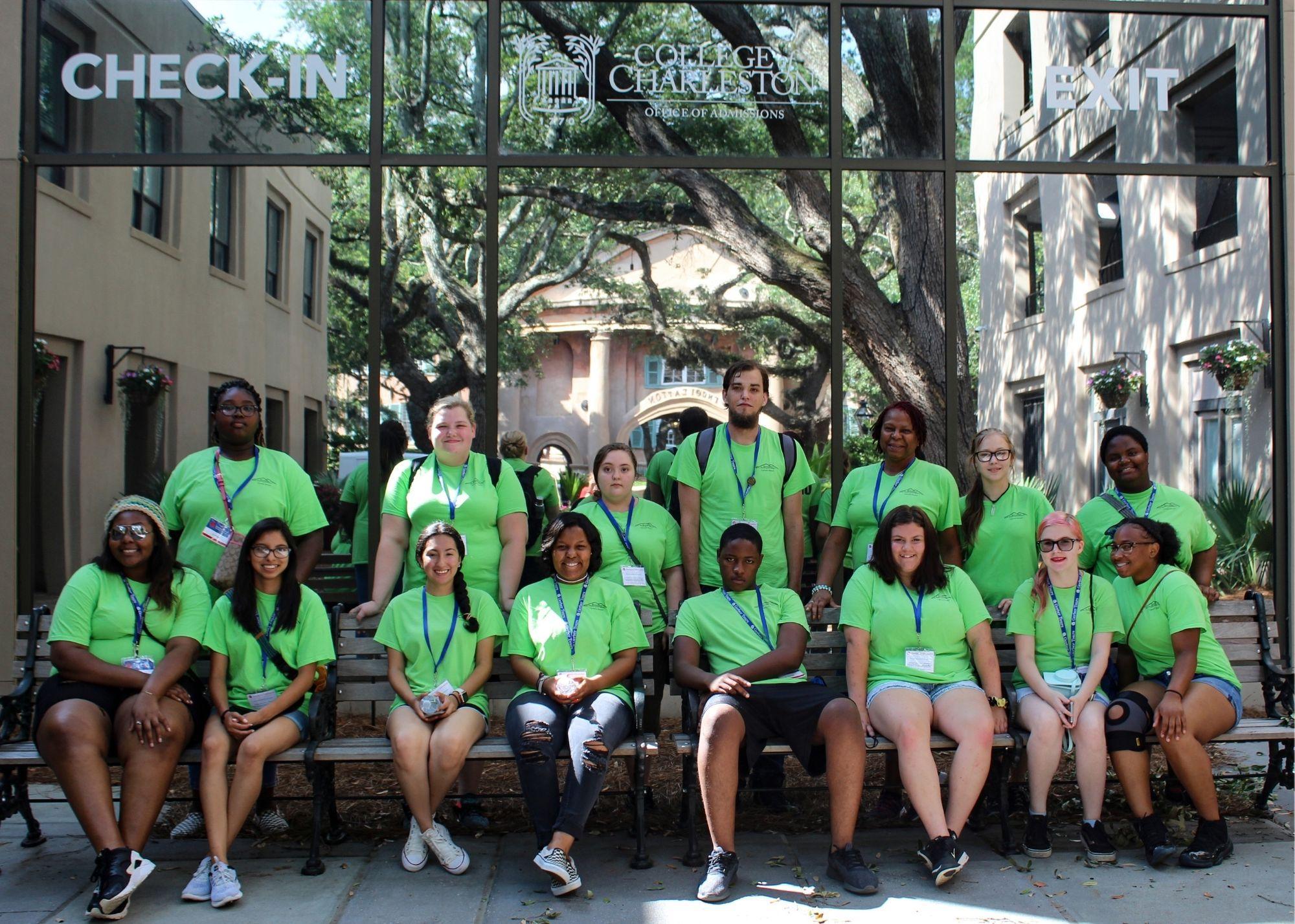 Students wearing green shirts posing for a picture in an outdoor setting.  / KSU TRIO Students have the opportunity to go on an out of state, educational field trip after full participation in the KSU TRiO Summer Academy. The trip is provided at no cost to students. 