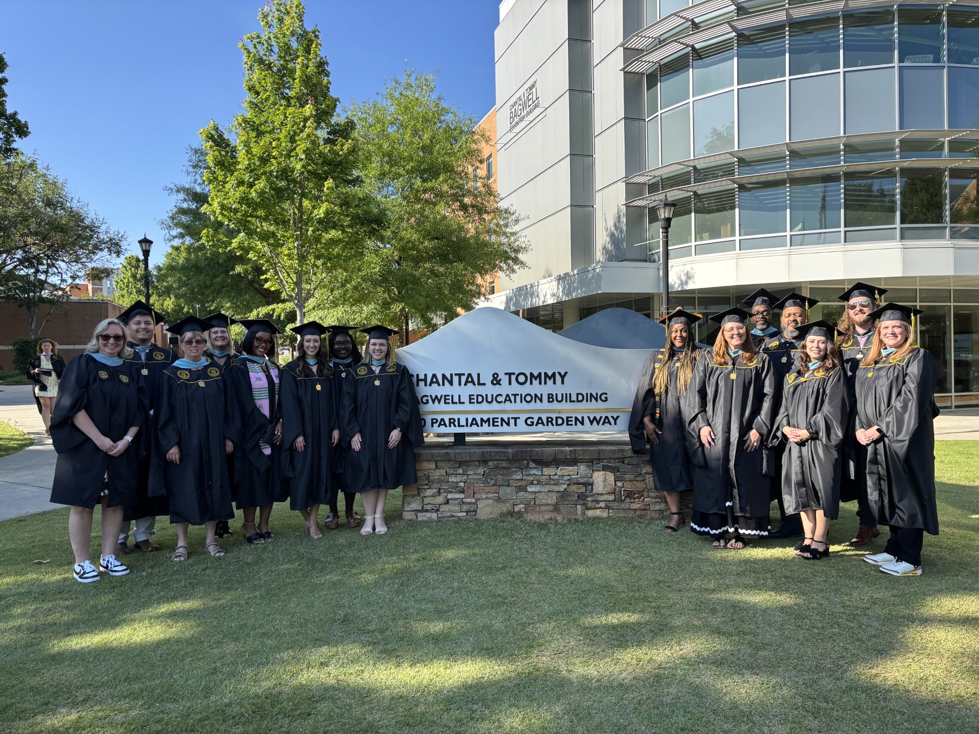 Educational Leadership Graduates standing in front of Bagwell College.
