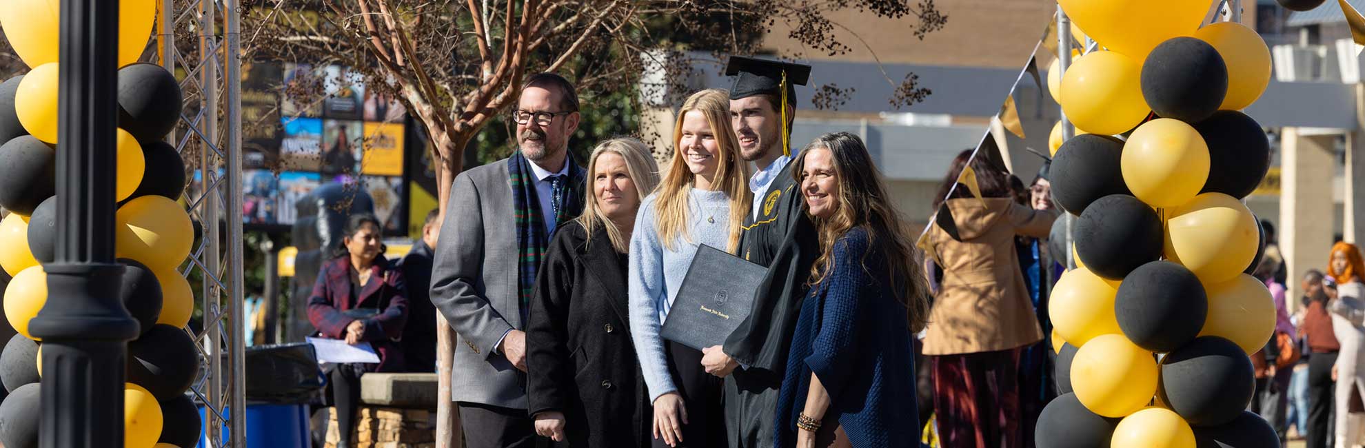 students and family after graduation