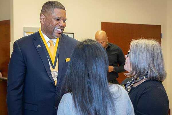 Bagwell College, Dr. Adrian Epps Investure talking with teachers