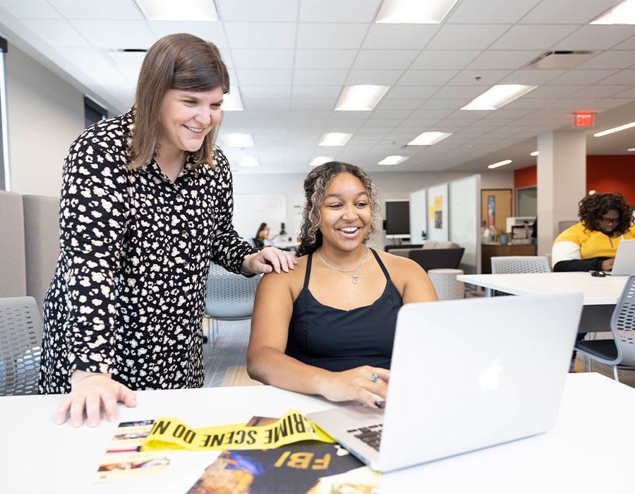 ksu faculty helping a student.