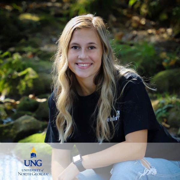Abagail Kimbell, a smiling student in a headshot with the University of North Georgia logo in the bottom left corner.