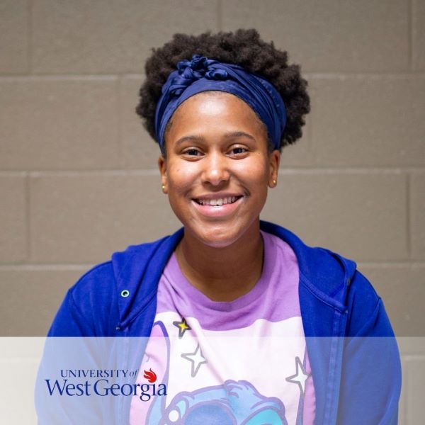 Ayanna Reed, a smiling student in a headshot with the University of West Georgia logo in the bottom left corner.