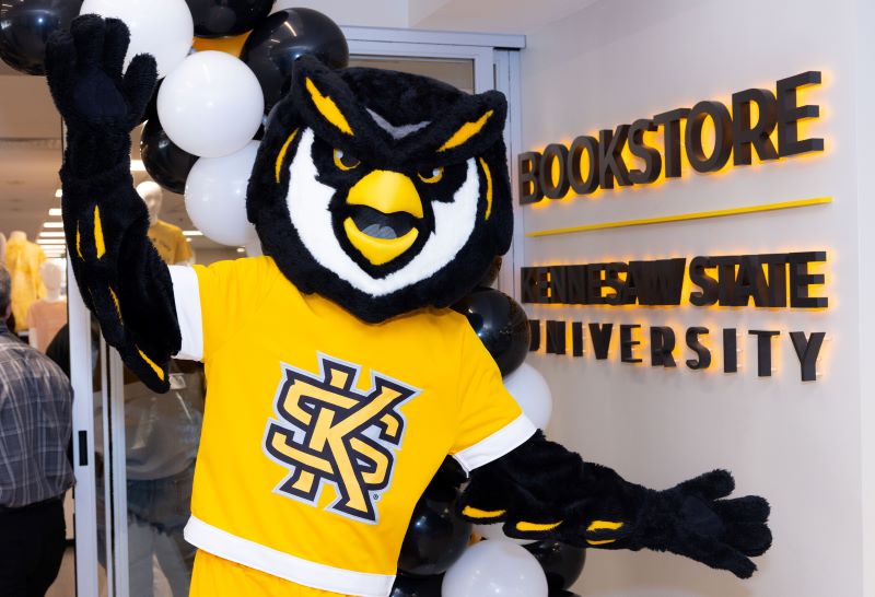 KSU mascot, Scrappy the Owl in front of the bookstore