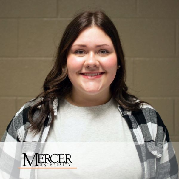 Chloe Jay, a smiling student in a headshot with the Mercer University logo in the bottom left corner.