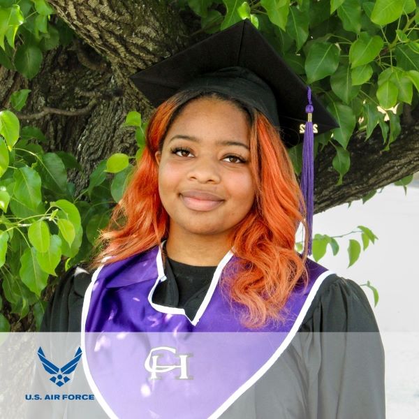 Jiyah McBride, a graduate wearing a cap and gown, with the U.S. Air Force logo in the bottom left corner.