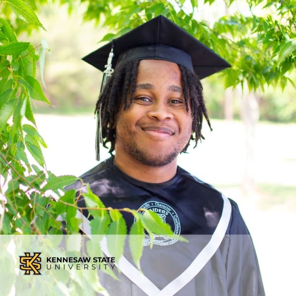 Joshua Thurmon, a graduate wearing a cap and gown with the Kennesaw State University logo in the bottom left corner.