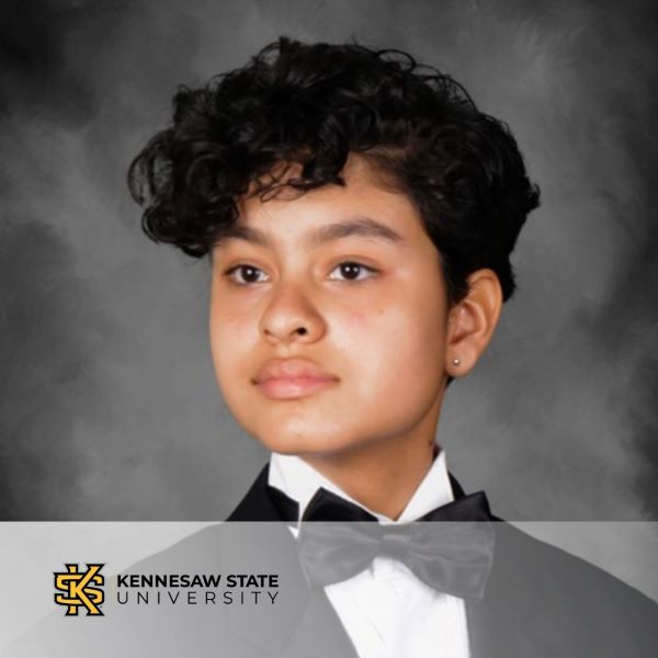 Laine Alam Murillo, in a headshot with Kennesaw State University logo in the bottom left corner.