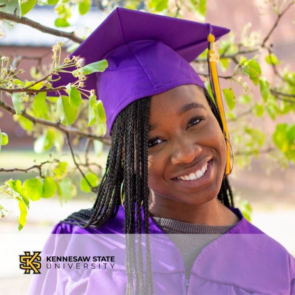 Lisa Shyllon, a smiling graduate wearing a purple cap and gown, with the Kennesaw State University logo in the bottom left corner.
