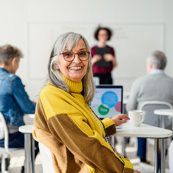 smiling woman in a class room