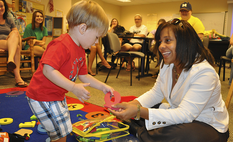 teacher with small child