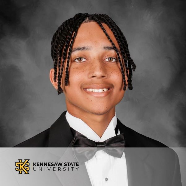 William Lockwood, a smiling student in a headshot, with the Kennesaw State University logo in the bottom left corner. 