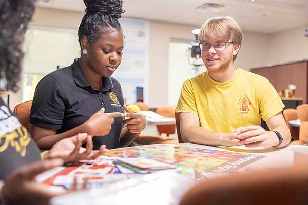students collaborating at table