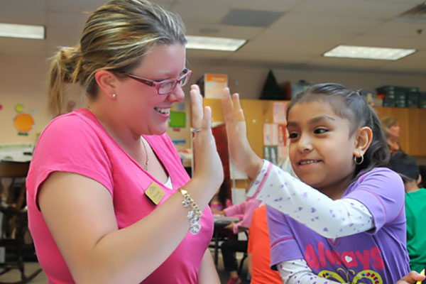 elementary teacher with student
