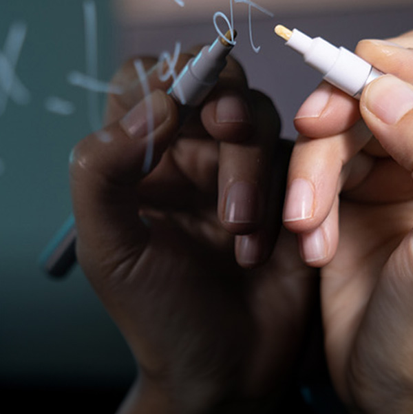 hand writing on a black-board