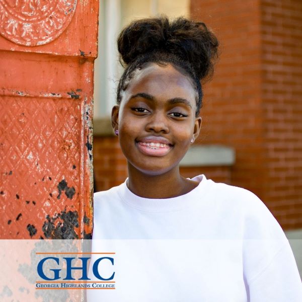 Ayisha Bukar, smiling in a headshot, with the Georgia Highlands College logo in the bottom left corner.