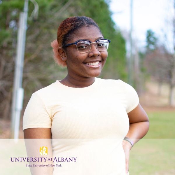 Chenese Griffith, smiling in a headshot, with the University at Albany logo in the bottom left corner.