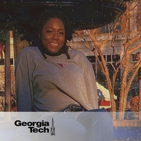 Dormecia Allen, posing and smiling in an outdoor setting with the Georgia Tech logo in the bottom left corner.